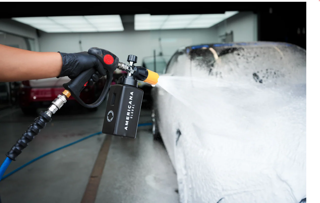 Foam cannon pre-soak at Ceramic Pro Fuel House — Americana Global foam blanketing a vehicle before hand wash